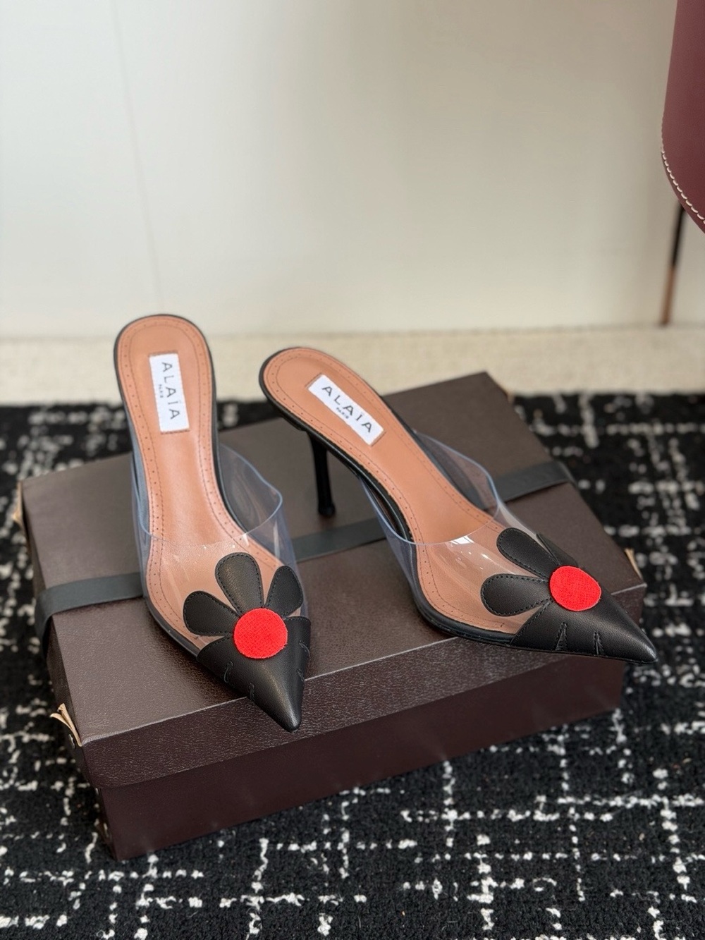 Alaia Black Leather Pointed Mules with Red Floral Accent